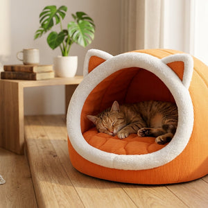 Cozy semi-enclosed cat ear cat bed with a cat resting inside in a warm home setting